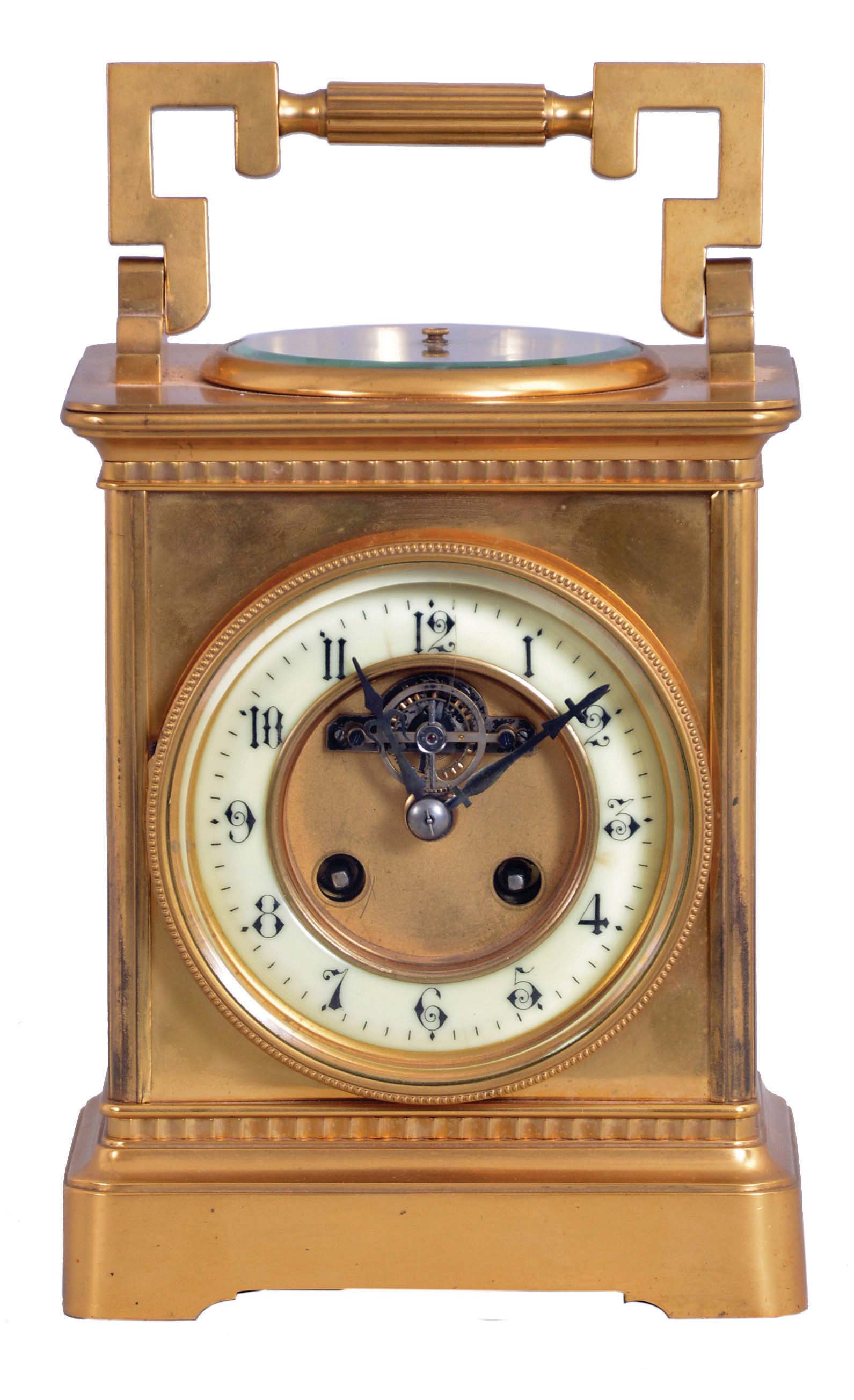 France, a large carriage clock with barometer and exposed balance, gilt bronze case with cavetto molded base and cornice, case top with inset barometer and large carrying handle, Arabic numeral white enamel dial with matte gilt, sunk center, and exposed lever platform below 12:00, balance oscillating beneath a silvered, openwork bridge, 8 day, time and strike movement with round plates, striking the hour and half hour in passing — Antique Clocks Price Guide
