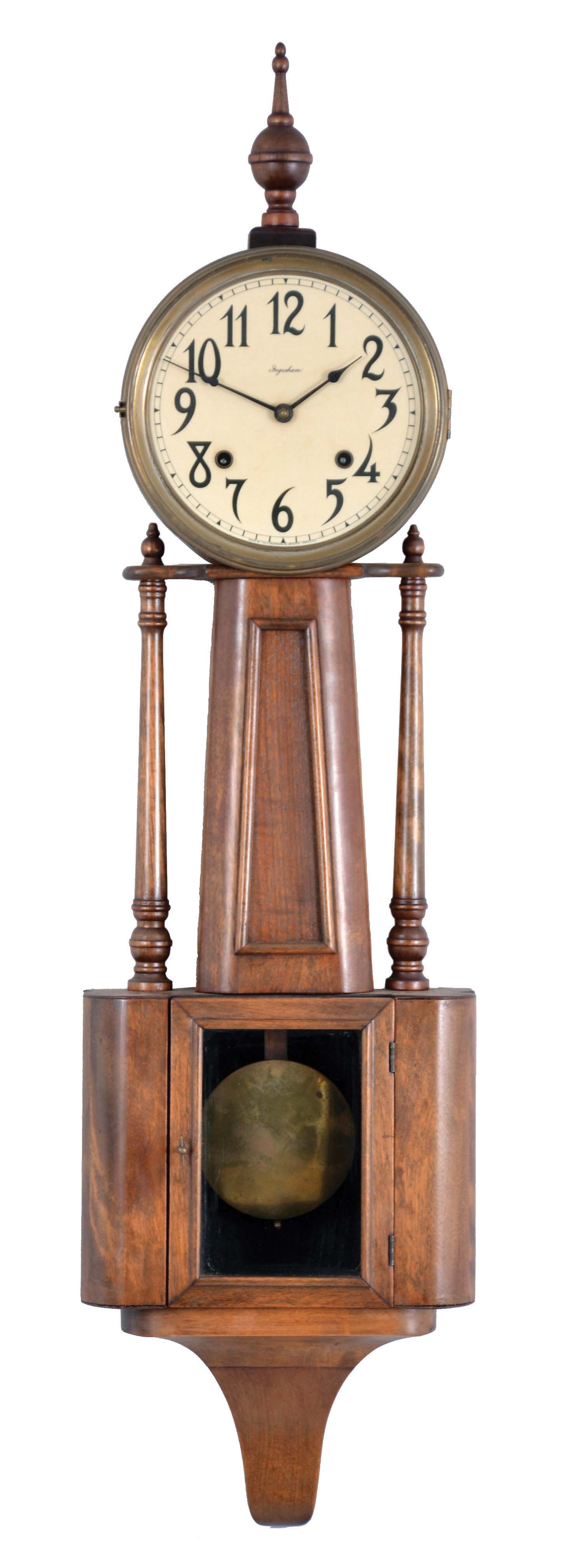 E. Ingraham & Co., Bristol, Conn., "Nile" banjo clock with a spring driven, 8 day, time and strike movement in a rubbed mahogany finish case — Antique Clocks Price Guide