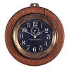 Chelsea Clock Co., Boston, Mass., for the Alabama Dry Dock and Shipbuilding Co., Mobile, Alabama, 8 1/2" "Pilot House" clock, polished brass case with mounting flange, fixed to round oak board with hanger, black dial with white Arabic numerals and hands, 8 day timepiece movement with rectangular plates, serial #300486