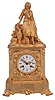France, a mid 19th century figural mantel clock, gilt bronze case with rococo revival ornament, the top with a young woman with fancy dress and head scarf, resting against a stump, taking a rest from carrying her ewer, Roman numeral white painted dial, gilt Louis XV hands, 8 day pendule de Paris movement by Raingo Freres