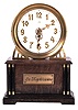German, Hamburg - American Clock Co., "La Mysterieuse" desk or table clock, rectangular oak base supporting the Arabic numeral transparent dial with brass bezel, movement contained in the base, and driving a second invisible disc to which the motion work is attached, thus driving the hands