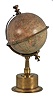 G. Thomas, Editeur, 11 Rue de Sommerard, Paris, an Edwardian globe clock, the cylindrical, quarter round molded brass base supporting a tapered, fluted column, attached to the stationary globe mount, engraved, Roman numeral equatorial ring with adjustable pointer, and 8 day timepiece movement concealed in the base, driving the globe through the a linkage in the column, c1890.