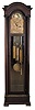 Colonial Manufacturing Co., Zeeland, Michigan, tall clock, quality German-made 8 day, time, strike three brass weight driven movement, with Westminster chime on tubes, in an inlaid mahogany case with full length full columns flanking a full length door with lower beveled glass, brass dial with moon phase and engraved spandrels.