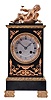 France, a small gilt and patinated bronze mantel clock in the Empire style, case with green patination and gilt mounts, surmounted by a reclining putto, Roman numeral, engine turned, silvered dial, blued steel Breguet style hands, 8 day, time and strike, pendule de Paris movement, signed Marti