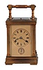 Margaine, Paris, for the English market, hour repeating carriage clock with alarm, the glazed, gilt case with torus molded base and cornice, the corners with fluted pilasters, and top with folding carrying handle, matte, gilt Roman numeral dial with subsidiary alarm chapter, blued steel Breguet style hands, 8 day movement with lever platform, sounding ting tang hours and half hours in passing, and repeating the last hour on demand, back plate with Margaine's mark