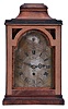 Daniel Quare, London, movement in later, purpose made bracket clock case, oak with mahogany veneers and brass furniture with later Roman numeral silvered sheet brass dial with date aperture and regulation control in the arch, blued steel hands, 8 day, five pillar fusee movement with verge escapement and pull quarter repeat, with beautifully engraved back plate bearing Quare's name.