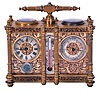 Victorian desk compendium of double carriage clock form, gilt brass case with turned feet, finials, and fluted columns, eight beveled glasses, and engraved panels with red enamel infill, the left side containing the clock, Roman numeral silvered dial, blued steel hands, 8 day time and alarm movement with lever platform, the right side with barometer and compass, both with silvered dials and blued steel indicators, case front also mounted with centigrade thermometer, case top with carrying handle