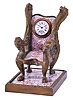Viennese armchair form desk clock, cast brass case set with polychrome enamel panels, the casting with foliate ornament and griffin heads at upper back, and arms with the heads of other mythical beasts, enamel panels done in typical 19th century Viennese style, with figures, and classical ornament, the chair back set with a 30 hour key wound timepiece