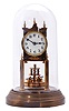 German 400-Day or Anniversary clock: (Retailer =Kuehl Clock Company, Chicago), time only spring driven movement torsion pendulum movement by Gustav Becker of Freiburg, Germany with disc pendulum in polished brass case under glass dome, c1910.