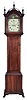 Edward S. Moulton, Rochester, New Hampshire tall case clock, the cherry case with fretwork top, turned finials and ogee bracket feet, numbered and signed by the maker, Roman numeral painted metal dial with seconds bit, calendar, and rocking ship, the back with label of Spencer & Nolen, Washington St., Boston, 8 day, time and strike, brass weight driven movement
