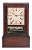 Bradley Manf'g Co., Southington, Conn. cottage clock with a spring driven, 8 day, time and strike movement in a rosewood veneered case.