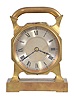France, desk clock, 8 day timepiece with balance wheel movement and directional compass on a brass base supporting an octagonal case on four feet, topped with a handle, c1900.