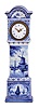 France, ceramic miniature tall clock, the earthenware case with blue, freehand decoration on a white ground, depicting harbor scenes with windmills on the trunk and base, with naturalistic ornament on the bonnet and base sides, Roman numeral white enamel dial with gilt Louis XV style hands, 8 day timepiece movement with cylinder platform, case bottom with makers mark