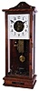 O.B. McClintock, Minneapolis, Minn., master clock, rectilinear birch case with beveled glass door and sides, Arabic numeral painted dial with open center providing a view of the modified Seth Thomas movement, separate count wheel chime movement mounted to case back, and with large clockwork motor in base driving a control arm for sending impulse to chime or bell hammers, case top with 14 output terminals