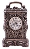 Charles Oudin, Paris, miniature Caryatides style carriage clock, the silvered case with caryatid corners, masks and detailed foliate ornament, case top with handle, and beveled glass allowing observation of the oscillating balance, Roman numeral, dead white silvered dial, blued steel hands, 8 day timepiece movement with lever platform, the case bottom signed "Cles. Oudin 52 Palais Royal Paris"