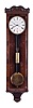 Paul Siemeth, in Wien, 30 day hanging regulator timepiece with sweep seconds in the Biedermeier style, rectilinear, 5 light, mahogany veneered case with boxwood stringing, beveled door, incurved bottom bracket with ripple moldings, and ripple molded cornice, case top with applied foliate carvings, signed Roman numeral white enamel dial, blued steel hands, cylindrical brass weight, and pendulum with ebonized rod and brass bob