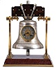 France, industrial series "Church Bell", gilt trimmed griotte marble base below stylized A shaped frames supporting the silver bell with oak headstock, all hardware in silvered or gilt finish, the bell front engraved "VAE. MIHI. SI. NON. EVANGELISAVERO" below the Roman numeral silvered dial, blued steel hands, 8 day, time and strike movement with lever platform