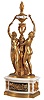 France, a large and impressive figural table clock with annular dial, the white marble base with bow front and back, each with a bead molded, blued steel door, mounted with gilt bronze ornaments, composed of a pair of crossed arrows with bowknot, and intermingled leaves and vines, the sides mounted with gilt floral arrangements, and resting on a conforming, cavetto molded plinth, surmounted by two female nudes flanking a central column with triangular base, and supporting an urn with flame finial containing the dial, each figure bearing a torch to "illuminate" the annular display, high quality 8 day timepiece movement with lever platform contained in the base, and linked to the dial through a rod in the column, front plate marked "AC" within an oval, and numbered 174