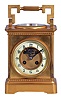 France, a large carriage clock with barometer and exposed balance, gilt bronze case with cavetto molded base and cornice, case top with inset barometer and large carrying handle, Arabic numeral white enamel dial with matte gilt, sunk center, and exposed lever platform below 12:00, balance oscillating beneath a silvered, openwork bridge, 8 day, time and strike movement with round plates, striking the hour and half hour in passing
