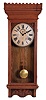 William L. Gilbert Clock Co., Winsted, Conn., "Regulator No. 14" hanging clock with a weight driven 8 day timepiece movement with dead beat escapement and retaining power, in an oak case.