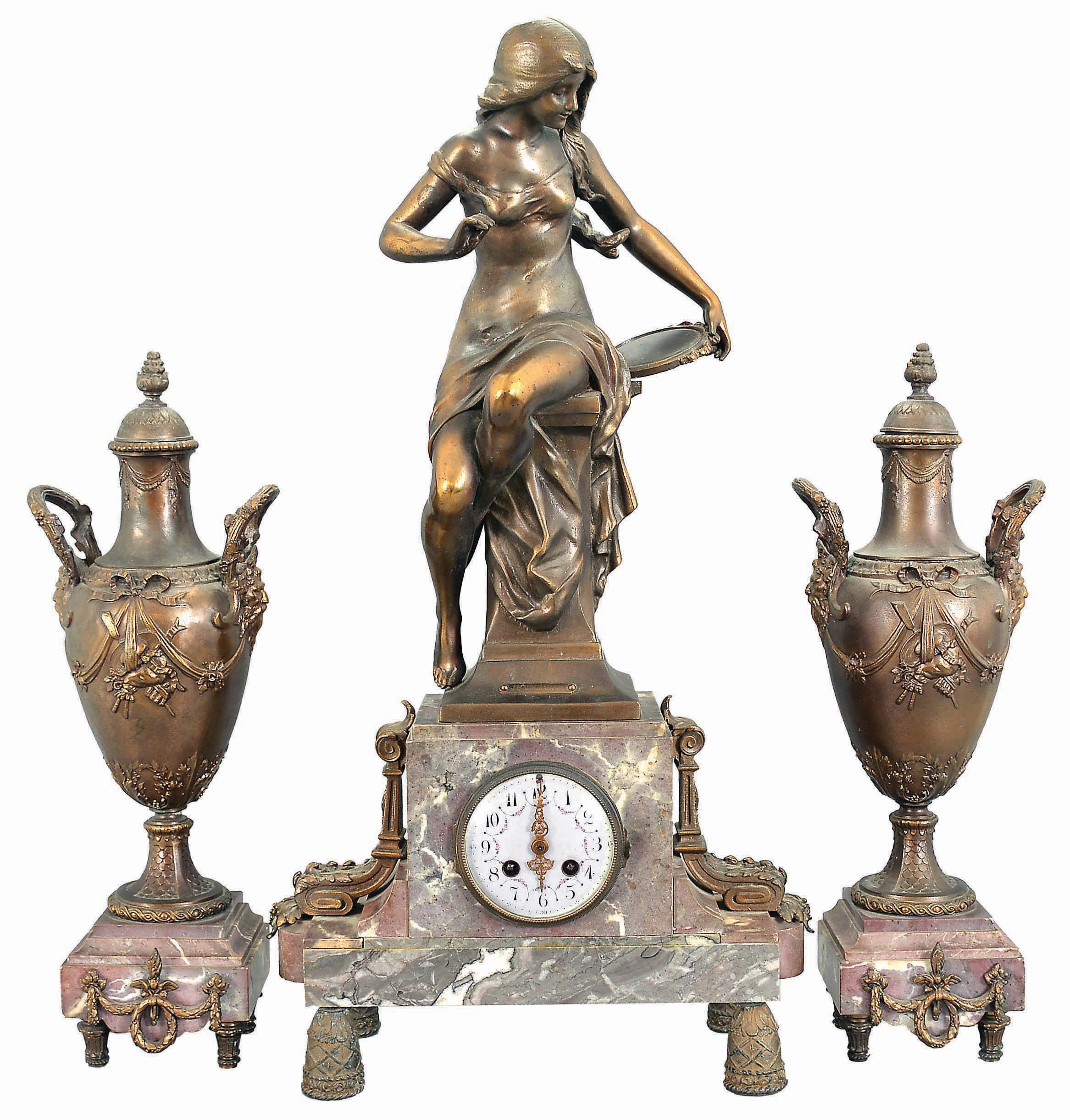 Irving Miller & Co., France, three-piece figural mantel clock with garniture, red and grey marble base on cast bell-shaped feet supporting clock with polychrome enamel dial, flanked by acanthus ornaments and surmounted by a cast spelter female figure depicting youth titled "Jeunesse". The movement is an 8 day spring driven time and strike pendule de Paris. Matching marble and cast metal vases with lids. — Antique Clocks Price Guide