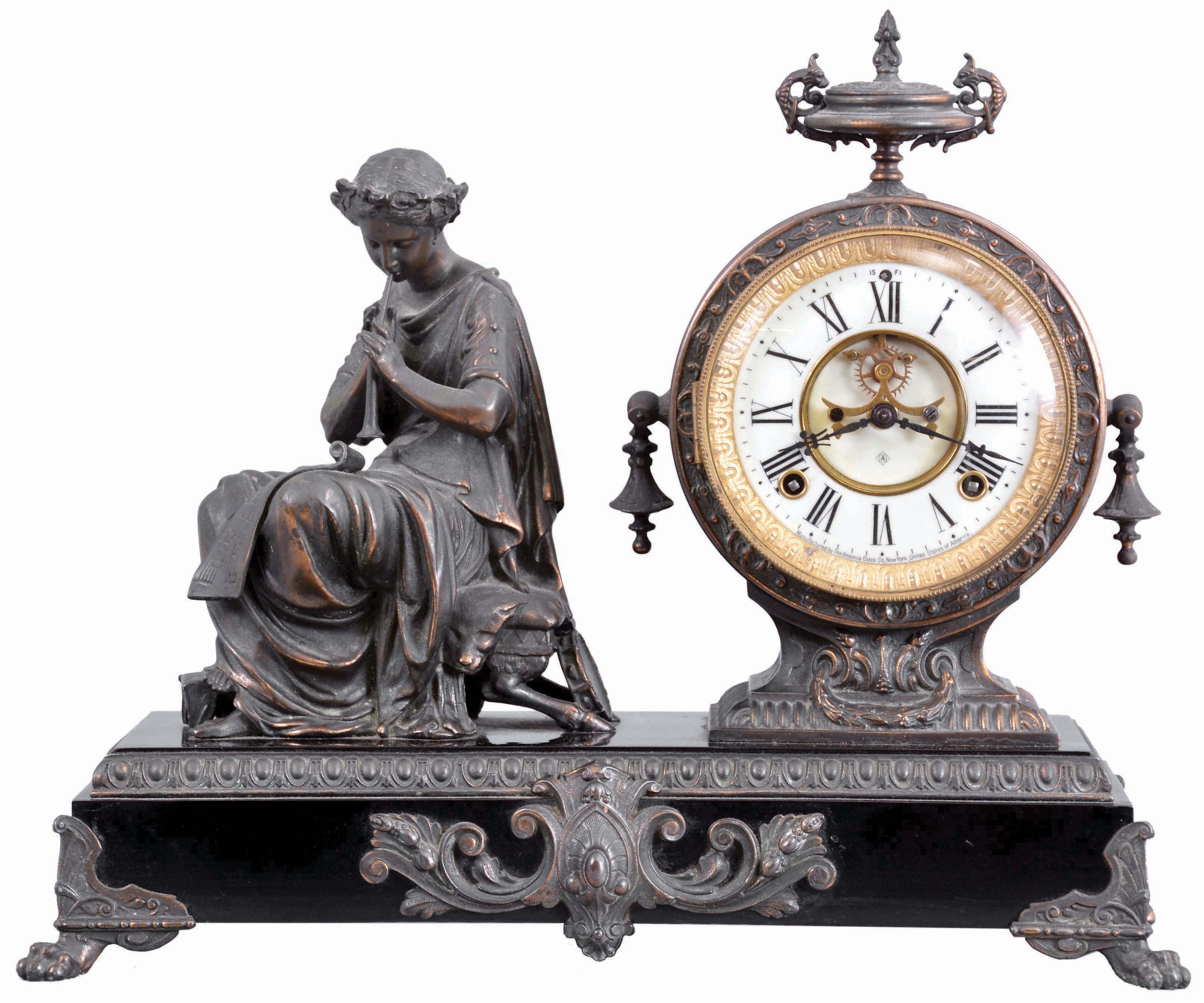 Ansonia Clock Co., New York, "Fantasy" Figure Clock with a spring driven, 8 day, time and strike movement visible escapement) in a cast metal and enameled iron case. — Antique Clocks Price Guide
