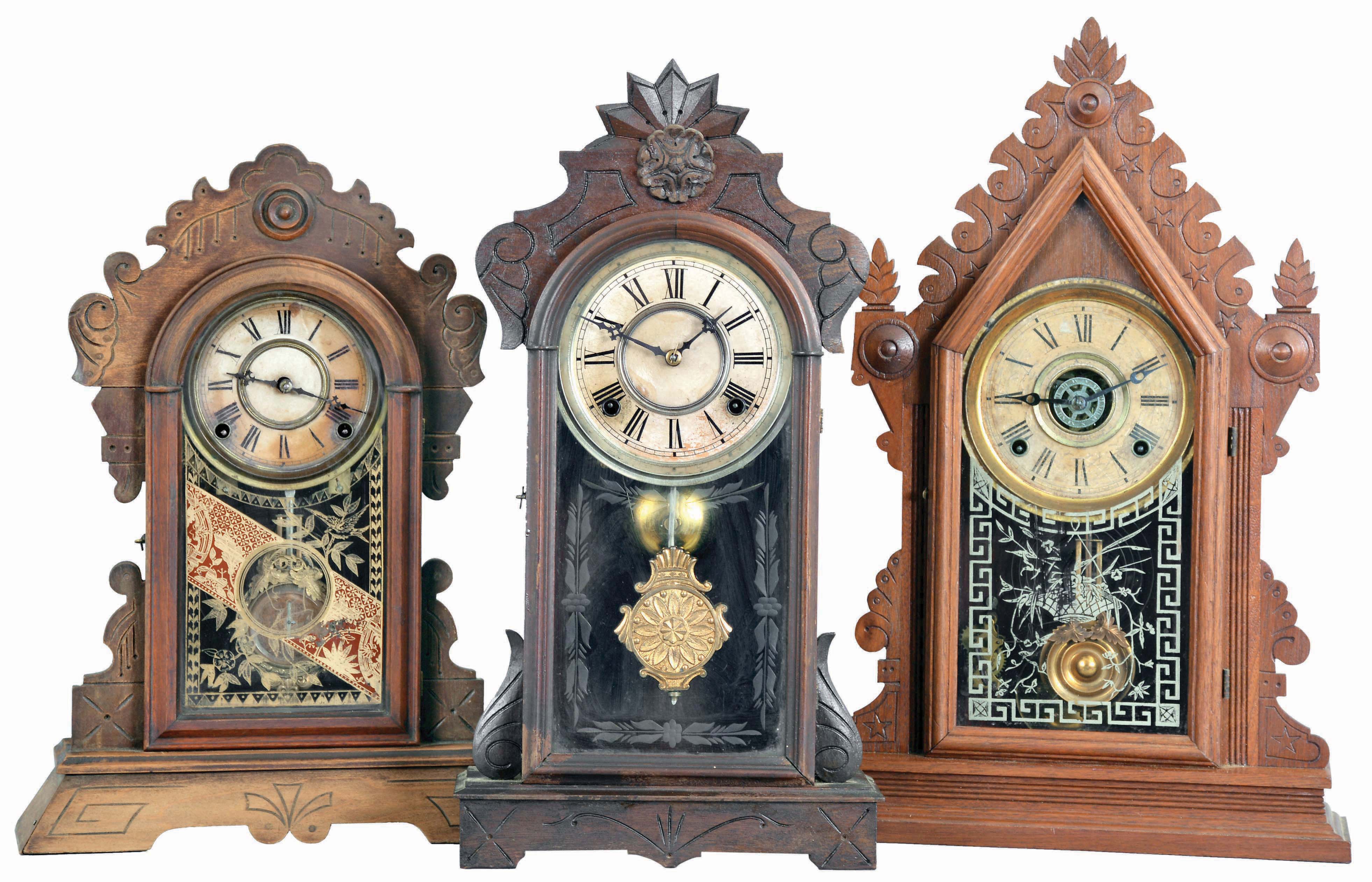 Clocks- 3 (Three): (1) E, Ingraham CLock Co., Bristol, Conn., "Cadet" shelf clock with a spring driven, 8 day time, strike & alarm movement in a walnut case, c1881; (2) Gilbert Clock Co., Winsted, Conn., "Argus" shelf clock with a spring driven, 8 day, time and strike movement (George B. Owen, Winsted, Conn.) in a walnut case, c1885. (3) F. Kroeber Clock Co., 6 Cortlandt Street, New York, "Wasp" shelf clock with a spring driven, 8 day, time and strike movement in a walnut case, c1884. — Antique Clocks Price Guide