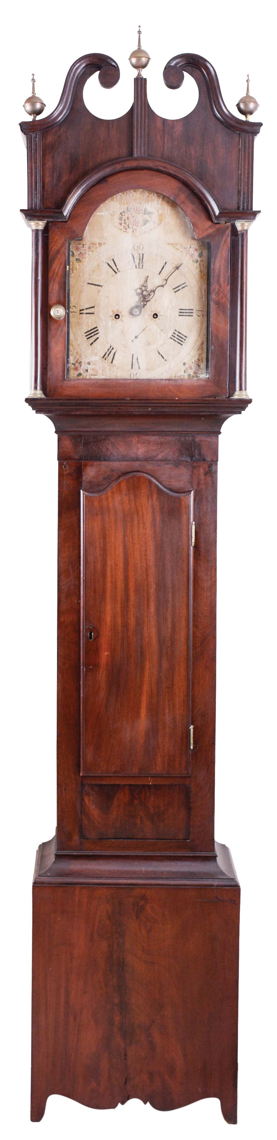 New York stye tall case clock, 8 day, time and bell strike, weight driven movement in a mahogany veneer case with broken arch top, shaped trunk door and scalloped skirt and foot. The painted wooden dial has a seconds bit. — Antique Clocks Price Guide