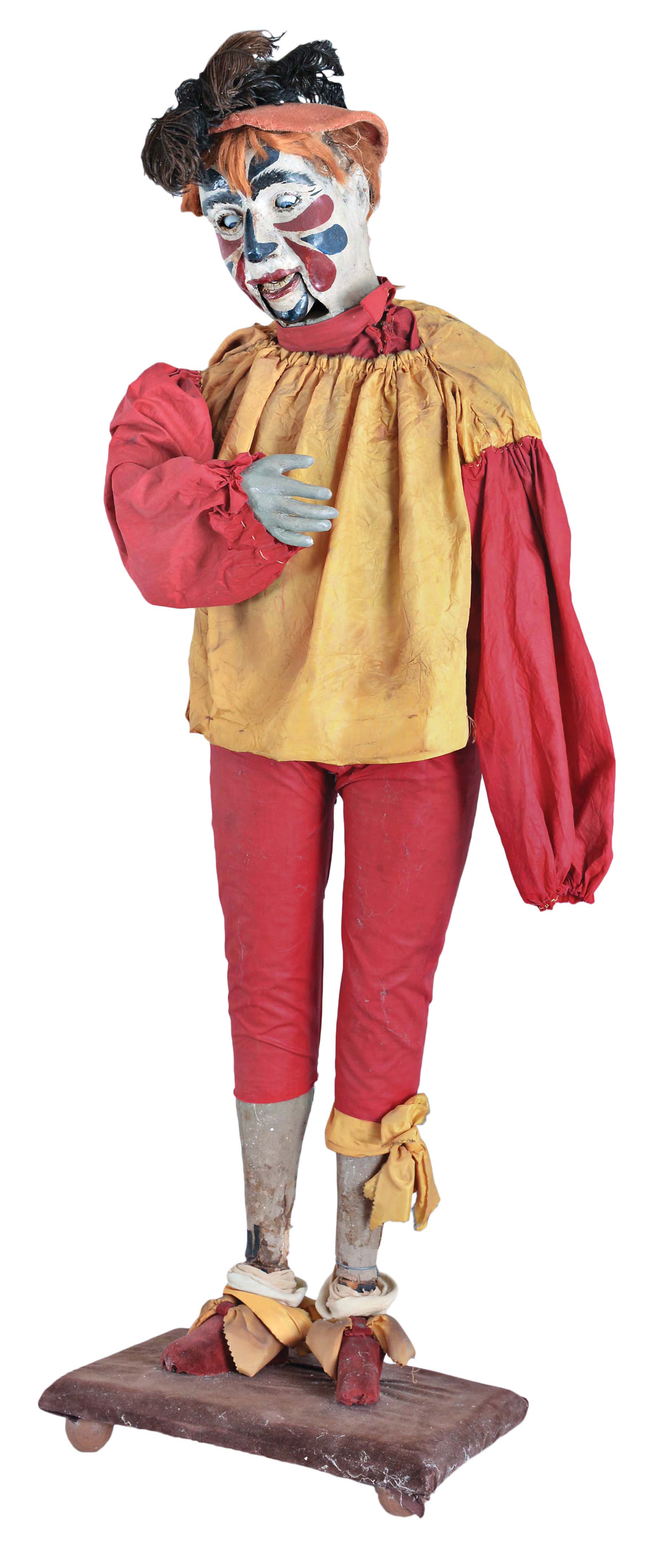 Clown automaton. unknown origin, late 19th century, with some more recent clothing. A very interesting piece, the head nods, eyes and jaw move and right arm lifts and falls. Wound and actuated from the clown's back, not working properly. — Antique Clocks Price Guide
