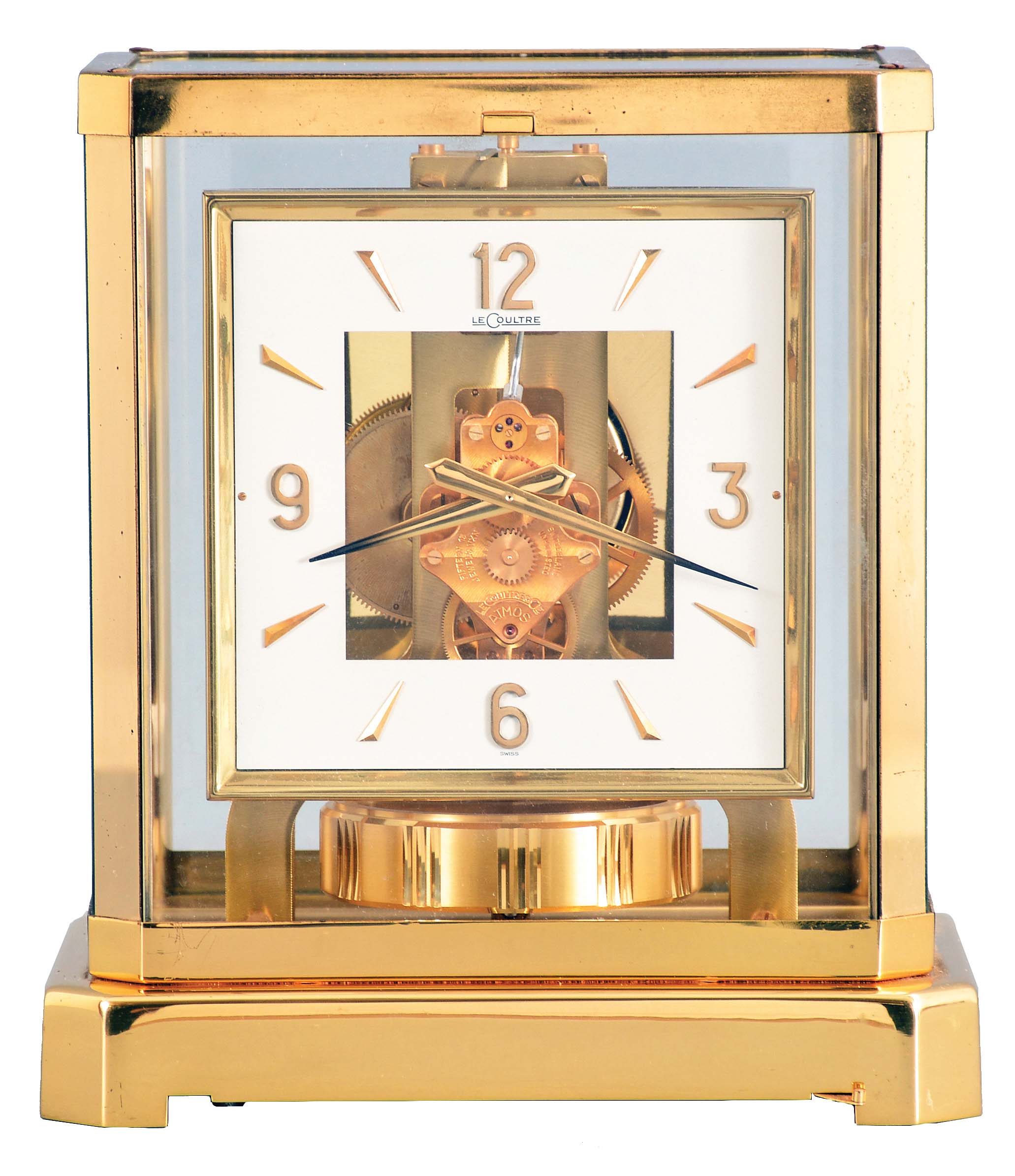 Jaeger- LeCoultre, Switzerland, "Atmos" clock, 15 jewel, caliber 528-8 movement, torsion pendulum, square white painted dial with applied gilt Arabic numerals and arrow markers, gilt hands, all contained in a glazed rectangular case with dedication plaque, serial #256226, c1968. — Antique Clocks Price Guide