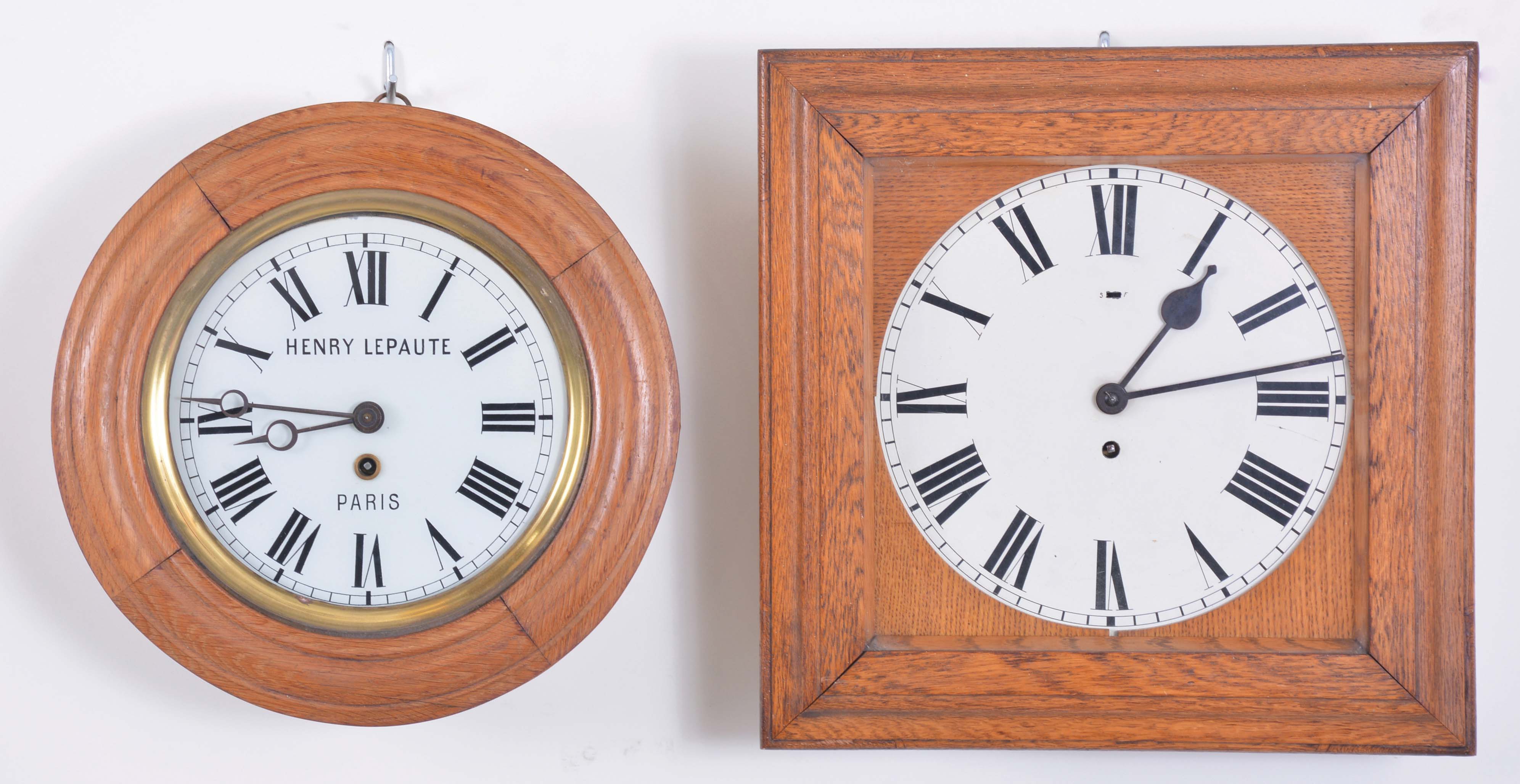 Clocks- 2 (Two): (1) France, 8 day, spring brass movement "Baker's Clock", wall timepiece signed "Henry Lepaute, Paris" c1900; (2) Germany, 8 day, spring brass lever movement wall timepiece. Brass movement is stamped "Million". — Antique Clocks Price Guide