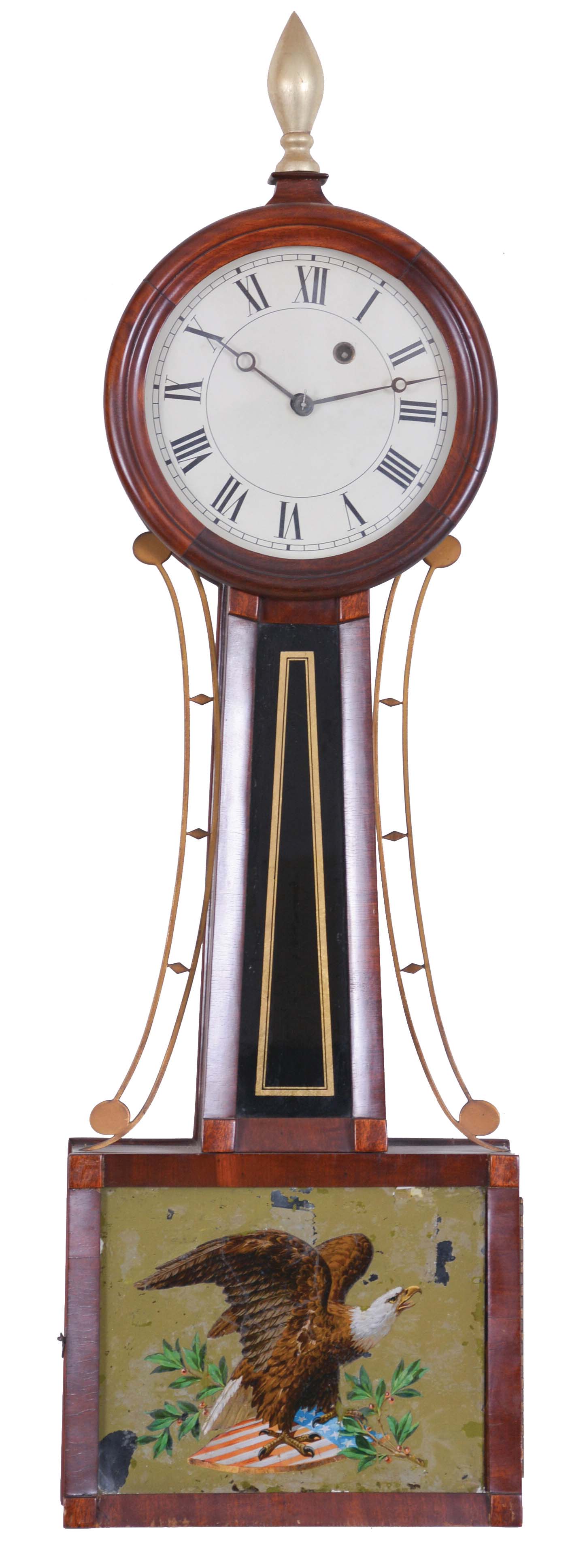 Unsigned, Connecticut and North Attleboro, Massachusetts, banjo wall clock, with poplar and mahogany veneered case, painted zinc roman numeral dial with moon hands, beveled flat frames enclosing the painted glasses, the waist glass flanked by brass side ornaments in black and gold, the lower glass, a later transfer and paint decorated American eagle perched on the American shield and olive branches, eight day brass movement with recoil escapement, lantern pinions, lead weight and pendulum. — Antique Clocks Price Guide