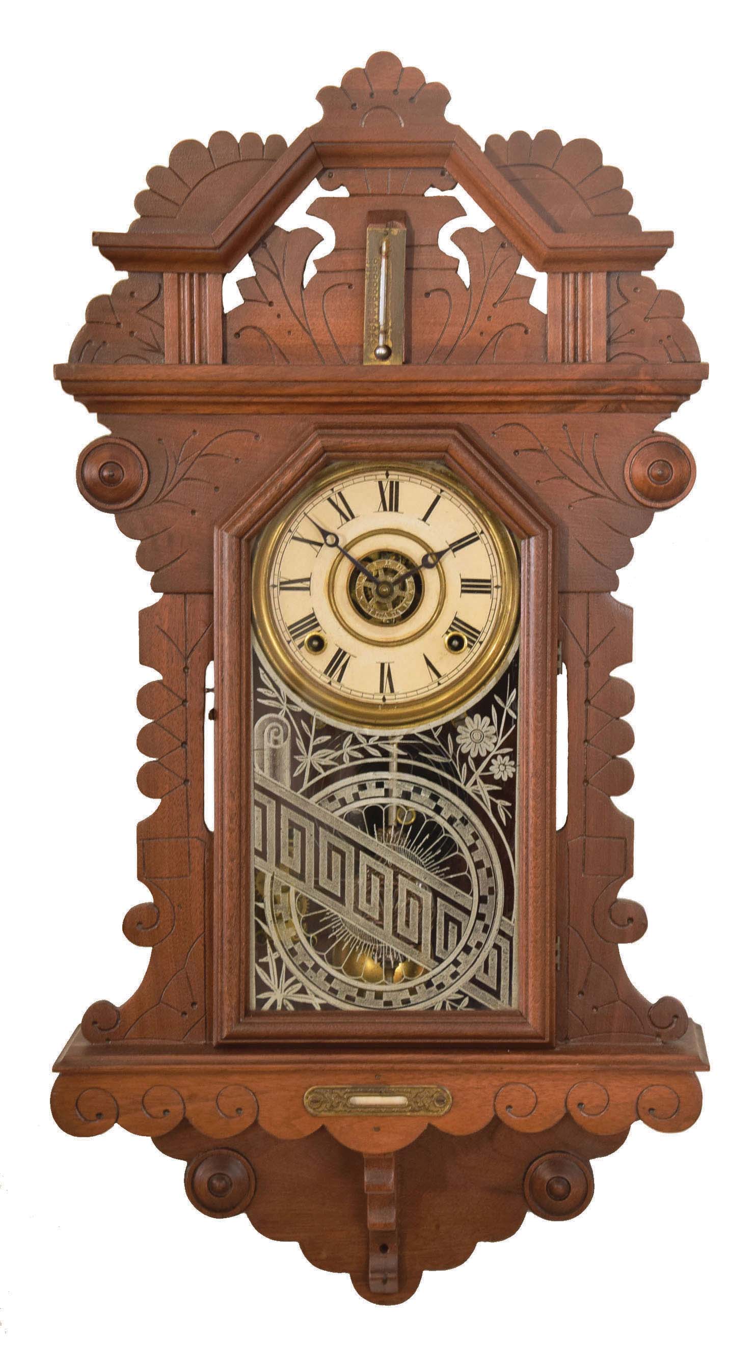 E. Ingraham & Co., Bristol, Conn., "? Drop", 8 day, time, strike and alarm spring brass movement wall clock. This premium model clock looks to be a variation on the "Amulet" mantel clock. There is a partial label that states this clock is manufactured exclusively for a company, but the name is difficult to read. — Antique Clocks Price Guide