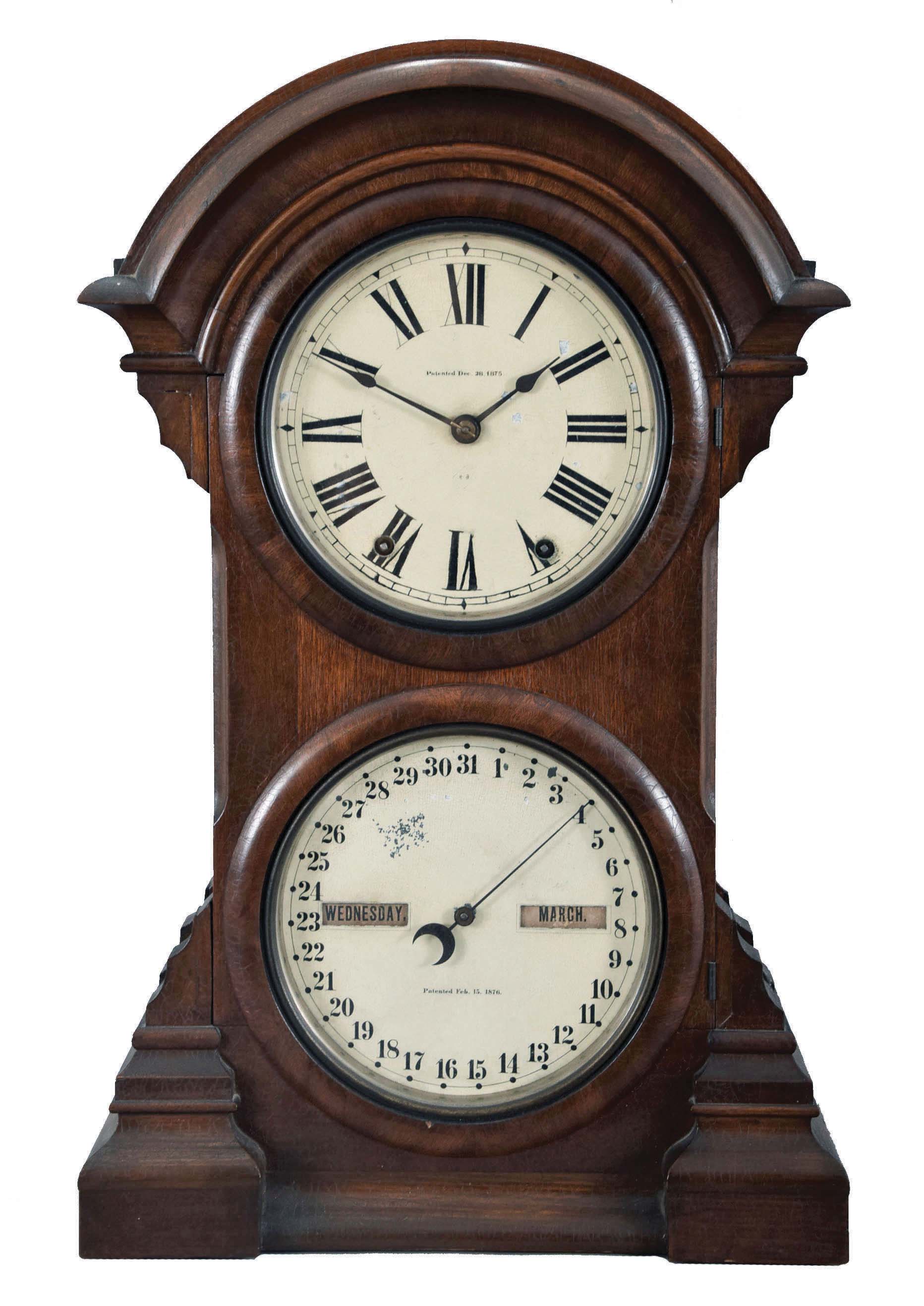 Seth Thomas Clock Co., "Parlor Calendar No. 4" double dial calendar clock with a spring driven, 8 day, time and strike movement and a R. T. Andrews patented perpetual calendar mechanism in a polished walnut case. — Antique Clocks Price Guide