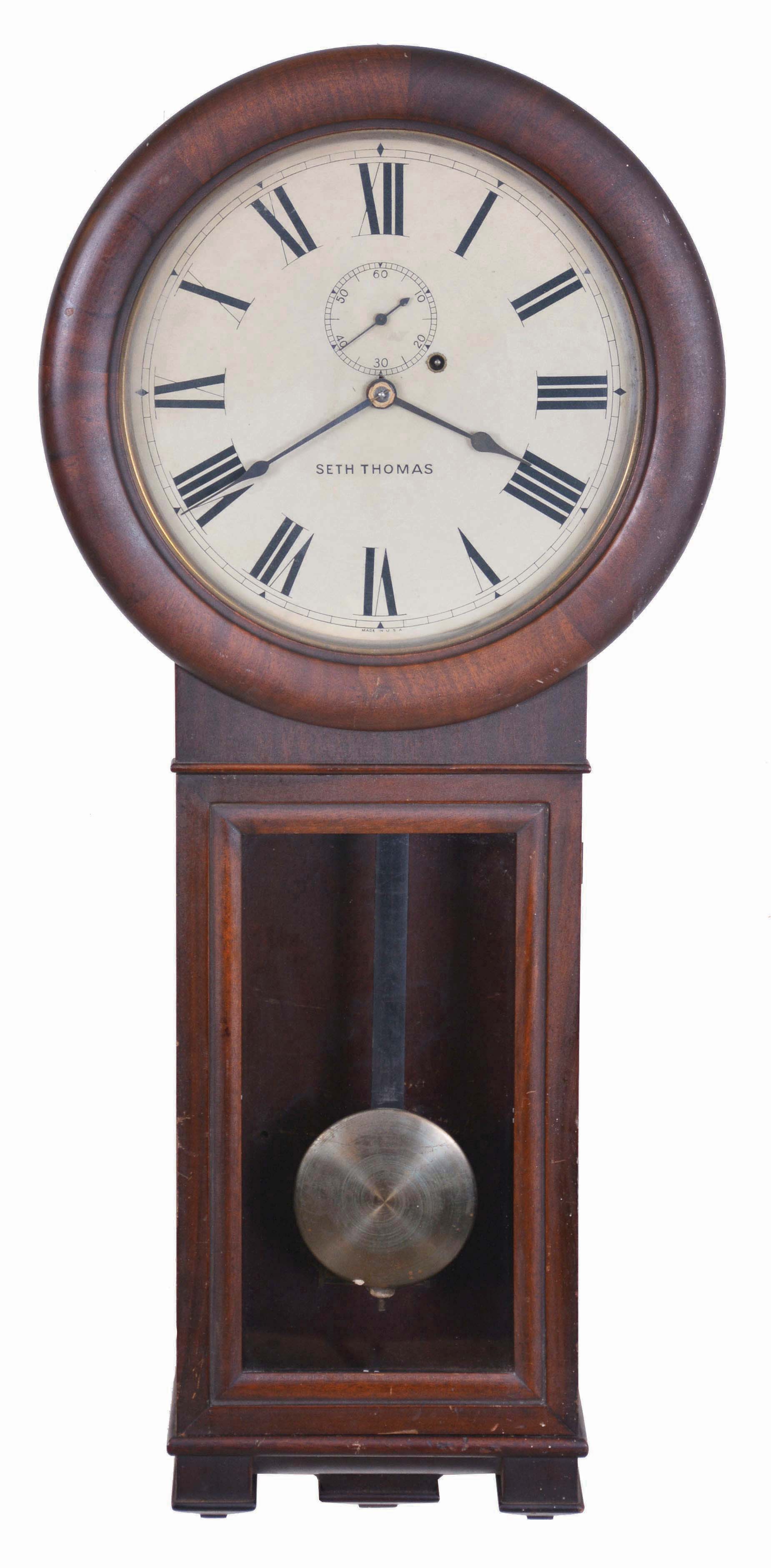 Seth Thomas Clock Co., Thomaston, Conn., "Regulator No. 2" wall hanging clock with a weight driven, 8 day time piece movement in a mahogany case. — Antique Clocks Price Guide