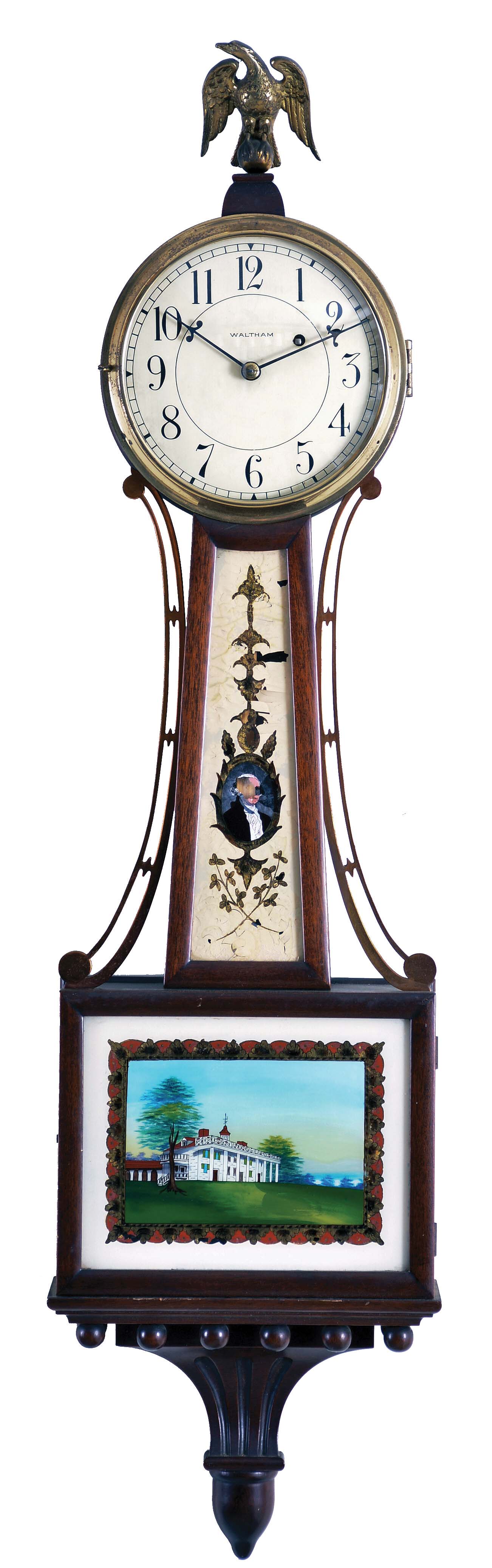 Waltham Watch Co., Waltham, Mass., Mahogany Banjo Clock, with pictoral glasses depicting Mt. Vernon and George Washington, the eagle finial caps the case over the Arabic numeral dial marked "Waltham", half round frames enclose the glasses, carved pedestal with acorn drop on the base, eight day time only brass movement inscribed "Waltham Watch Co." with dead beat escapement, maintaining power, Geneva stop, lead weight and pendulum. — Antique Clocks Price Guide