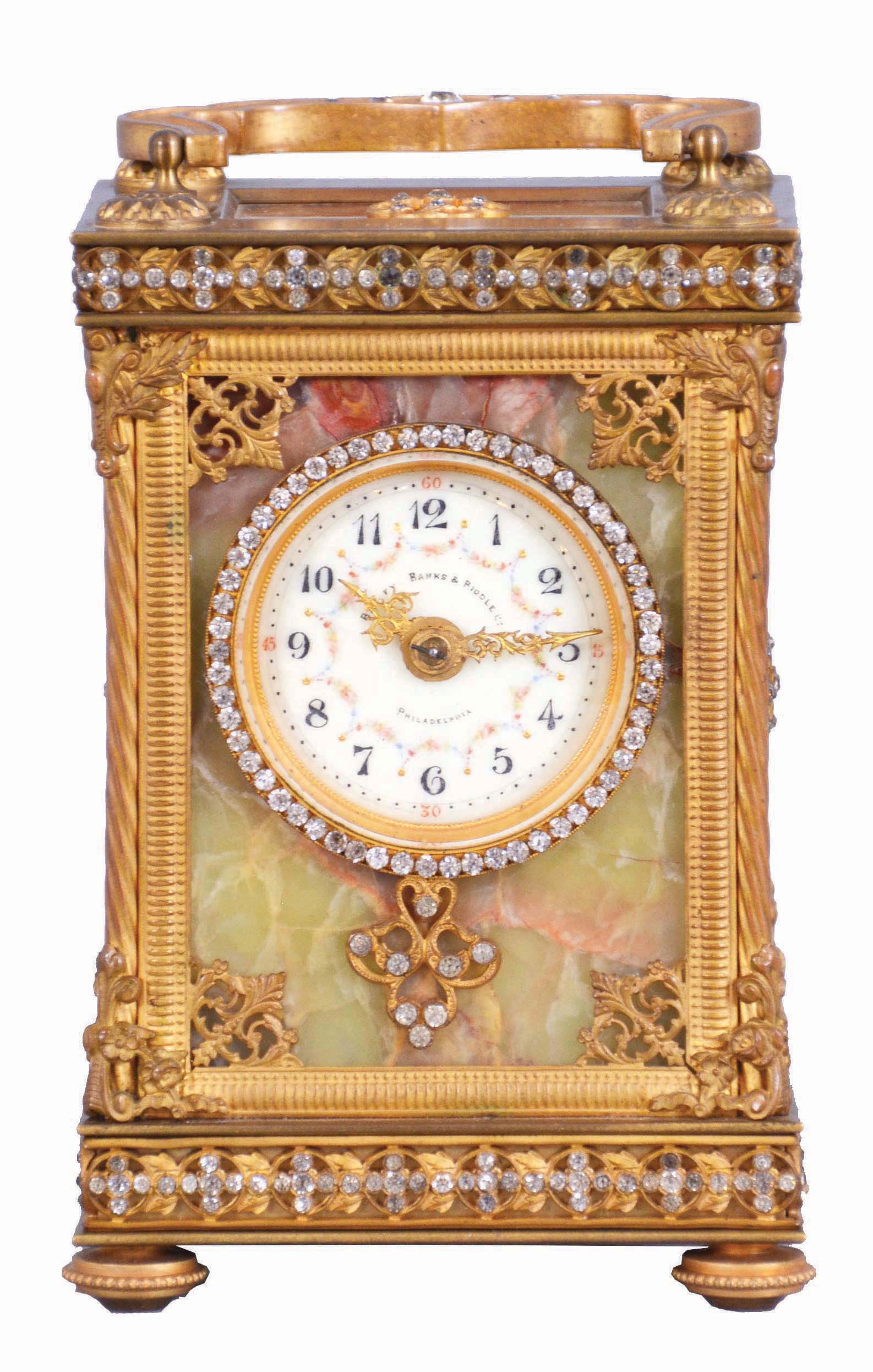 France, for Bailey, Banks & Biddle Co., Philadelphia, a very decorative striking carriage clock with original travel case, the gilt case with green onyx panels, top and base with gilt fret, the frets, handle and bezel set with brilliants, Arabic numeral white enamel dial with polychrome enamel floral garlands, gilt Louis XV style hands, 8 day, time and strike movement with lever platform counting the hours in passing, together with its original leather covered travel case and key — Antique Clocks Price Guide