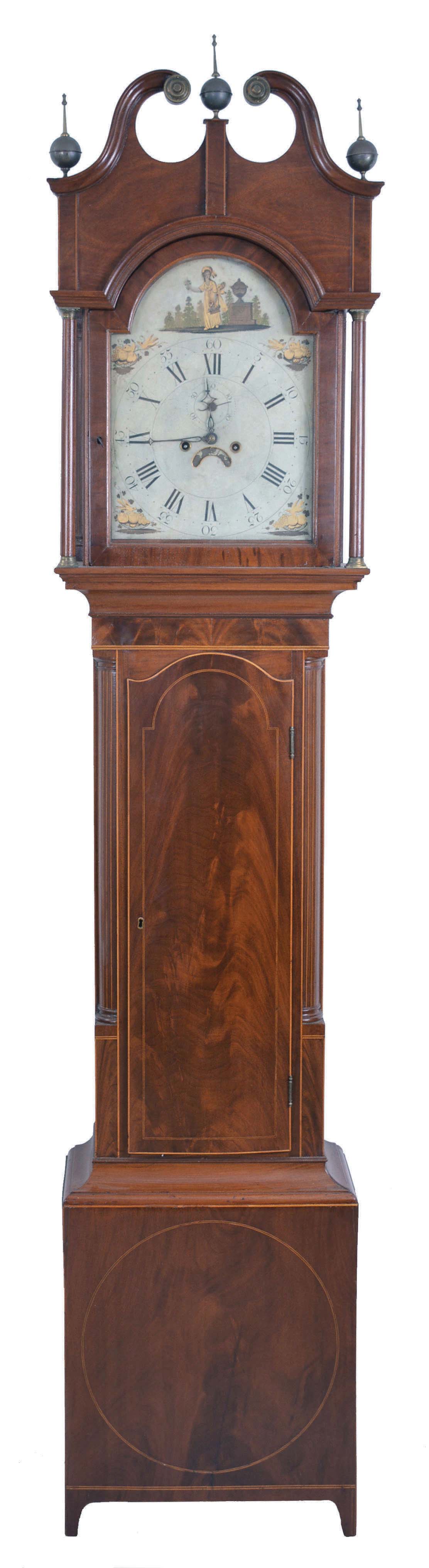 Unsigned, New Jersey tall clock, 8 day, time and bell strike, weight driven movement in a mahogany and mahogany veneer broken arch case with bracket feet, inlaid around circular crotch mahogany panel on plinth, boxwood border framing trunk door and corner columns with crotch mahogany panel, the hood door is flanked by two full columns that are inlaid with boxwood and ebony, three brass finials, brass rosettes on broken arch. The painted metal dial has female selling flowers in arch and painted fruit and bird gold spandrels and calendar disc under center arbor. — Antique Clocks Price Guide