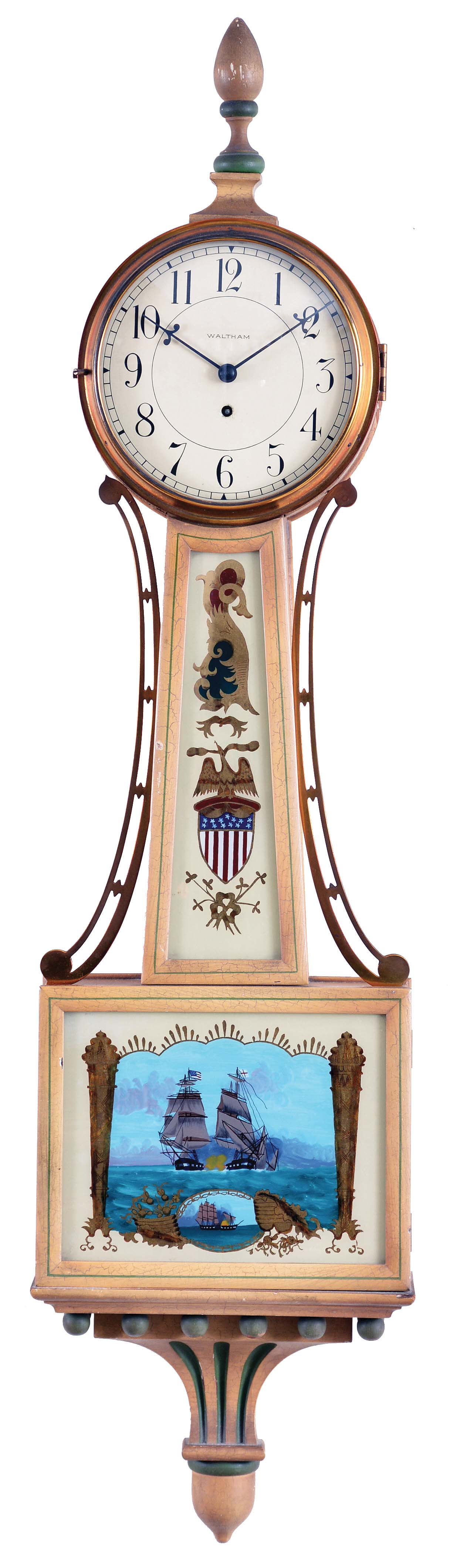 Waltham Clock Co., Waltham, Mass., banjo wall clock in off-white painted case stamped "1816", arabic numeral dial signed "Waltham", brass side ornaments flanking the reverse-painted glasses, the waist glass with eagle perched on a shield and the lower with a War of 1812 scene showing a British and American ship in battle, all on an off-white and green carved and painted pedestal, eight day time only brass spring powered movement secured to the back of the dial, with lever escapement and marked "Waltham Watch Co./USA". — Antique Clocks Price Guide