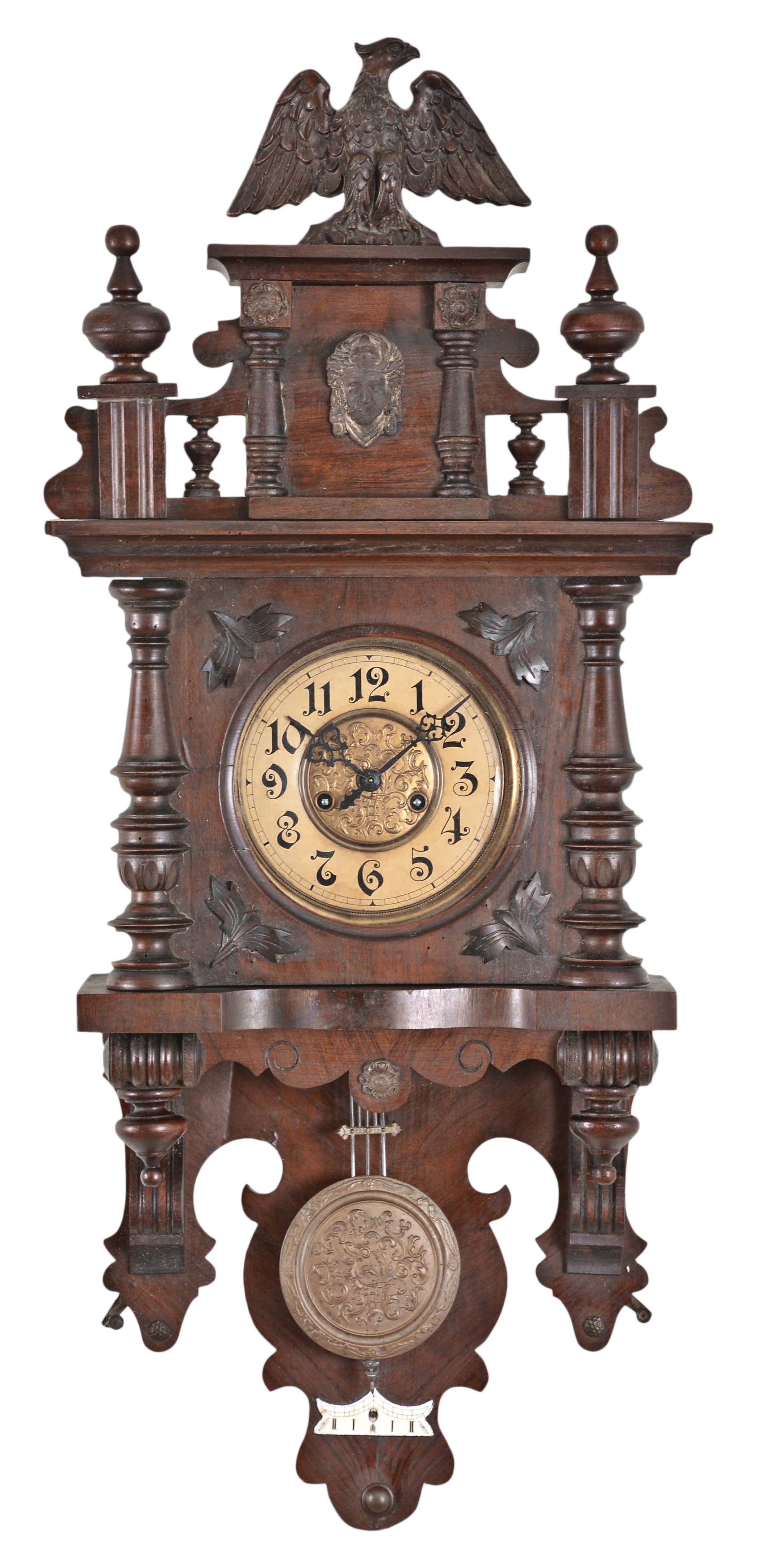 Germany, "Berliner' open well wall clock, 8 day, time and strike, spring driven movement in a walnut case with brass dial and matching embossed dial center and pendulum bob — Antique Clocks Price Guide