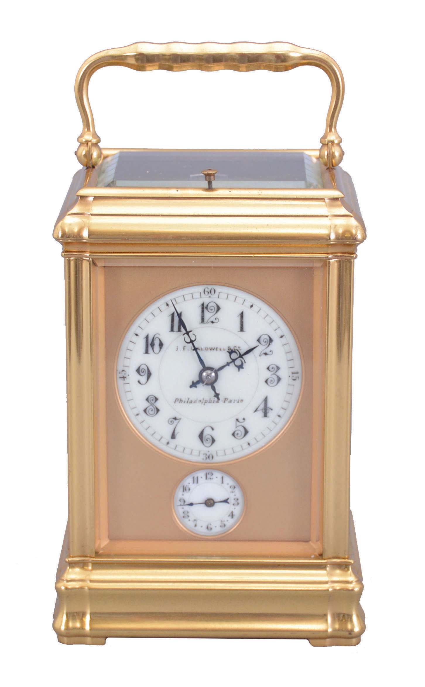 France, Carriage Clock, Grand Sonnerie, and repeat, with alarm, in a gilt gorge case, serial 5581, 8 day, lever escapement silvered platform escapement, case with cream colored dials, top dial signed J. E. Caldwell & Co. against a gilt mask, Philadelphia- Paris. — Antique Clocks Price Guide