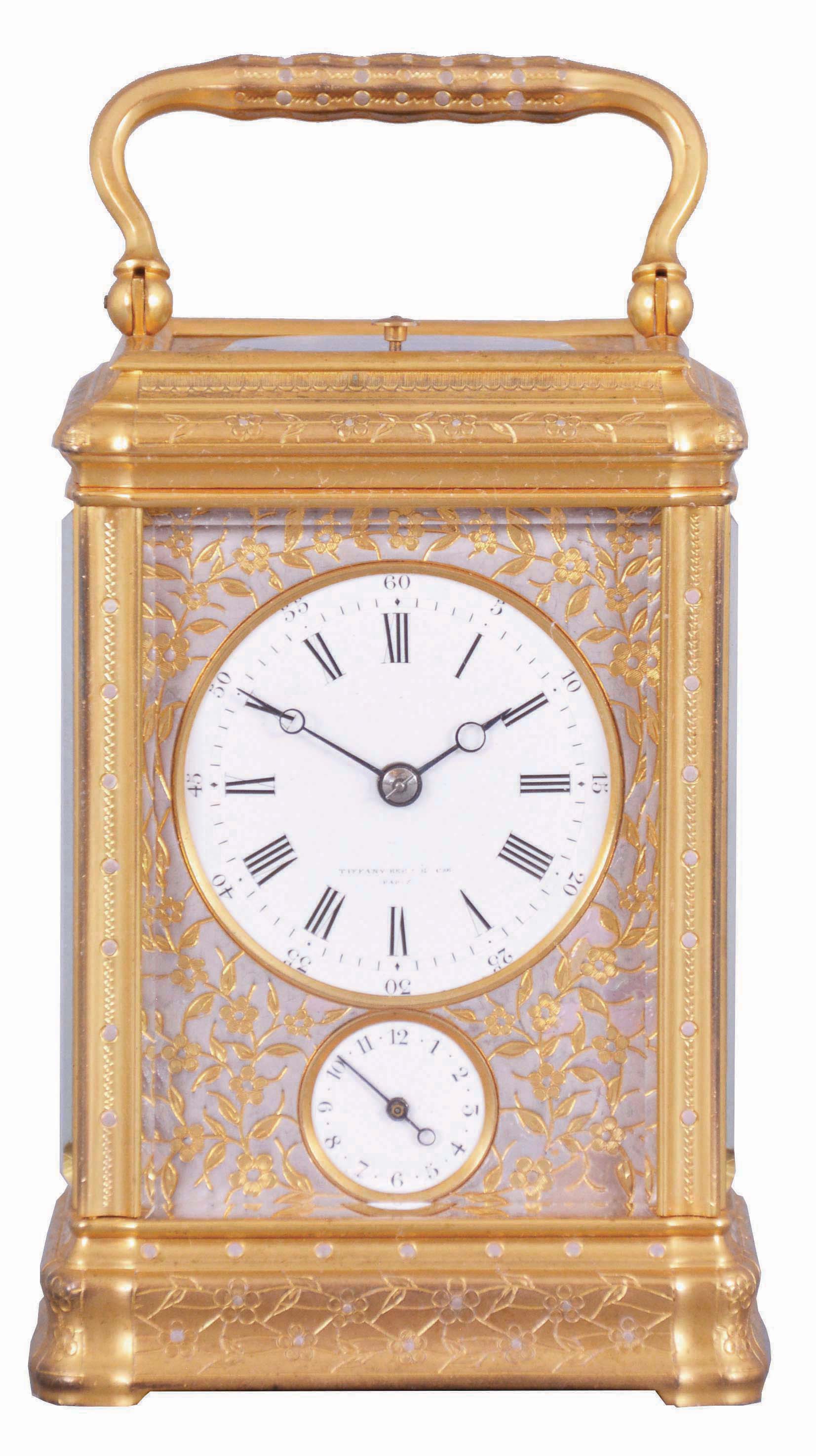 Drocourt, for Tiffany, Reed & Cie, Paris, a Gorge cased, hour repeating carriage clock with cold painted enamel ornament, gilt case with floral engraving and mauve accents, Roman numeral white enamel dial with engraved, gilt mask, also enhanced with mauve colored cold enamel, blued steel Breguet style hands, 8 day time, strike, and alarm movement with lever platform, repeating the last hour on demand, the back plate with the mark of Drocourt, serial #11150 — Antique Clocks Price Guide
