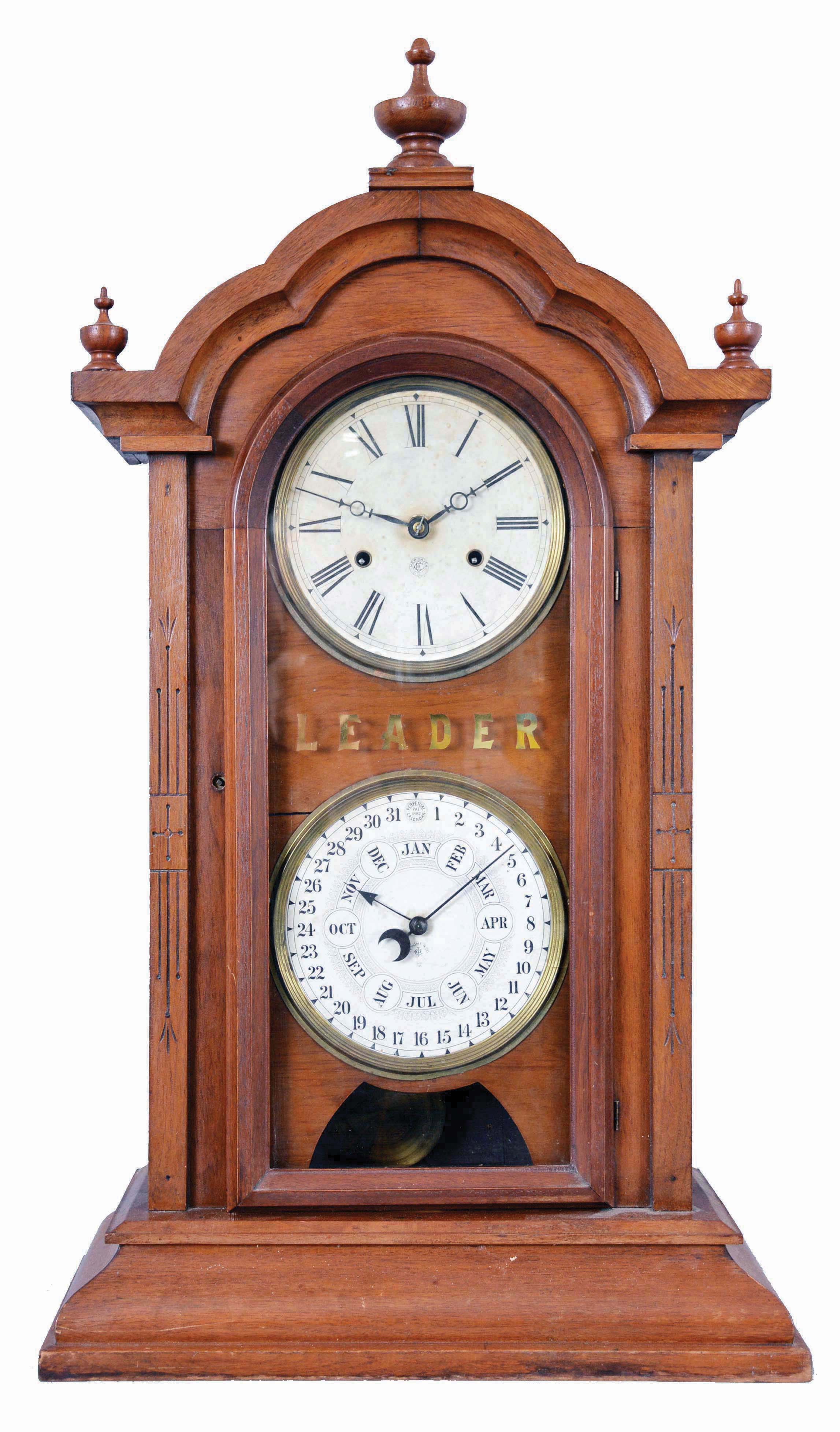 National Calendar Clock Co.,"Leader" shelf clock with a spring driven, 8 day, time and strike movement (New Haven Clock Co.) and a simple calendar mechanism in a walnut case. — Antique Clocks Price Guide