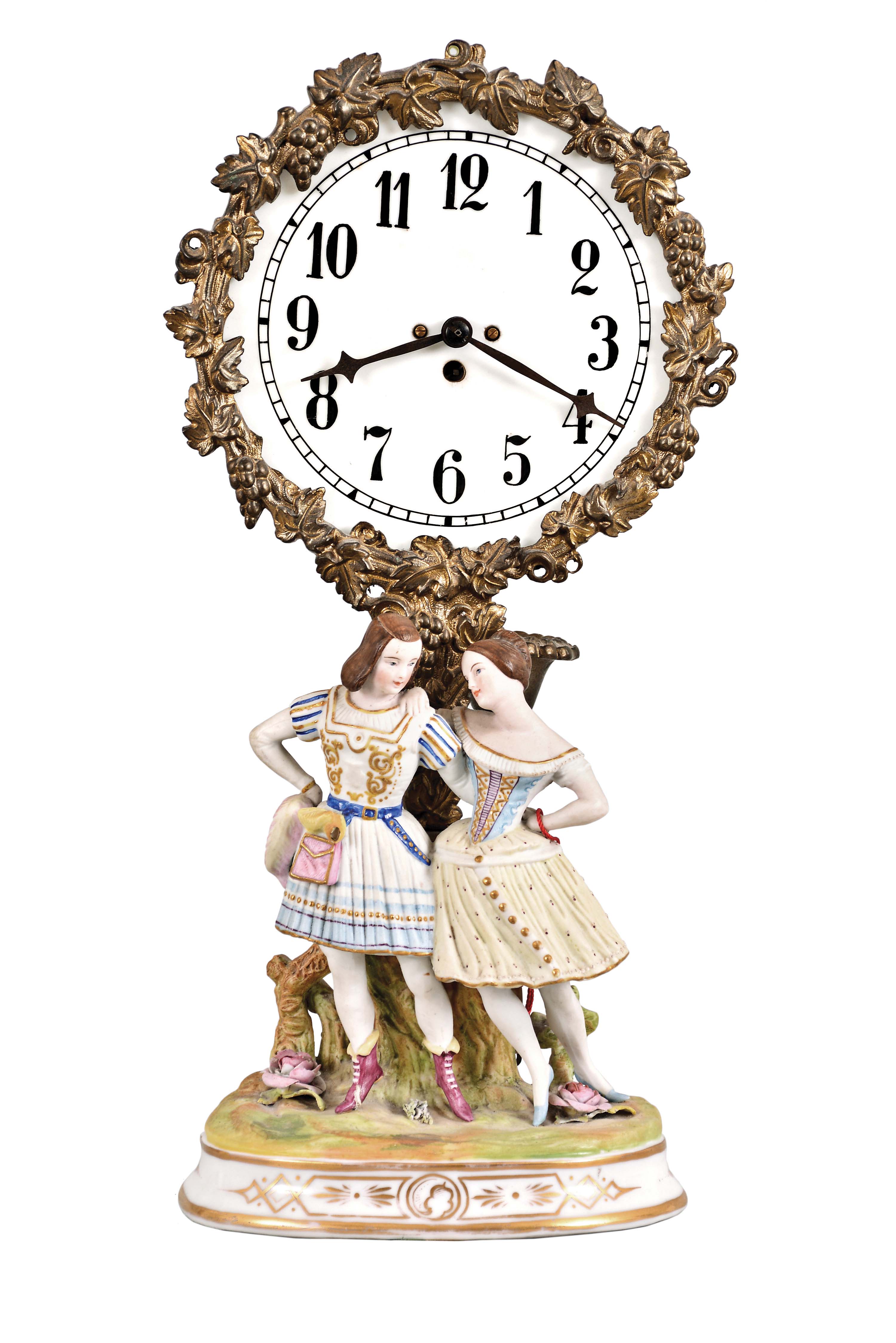 French Figural Bedside Night Clock with arabic numeral glass dial and diamond-shaped steel hands enclosed within a cast brass flower and fruit garland bezel and stand supporting a single candle holder at the back, two bisque young lady figures standing in joyful bliss in the flower garden all on a porcelain and gold decorated stand, one-day French movement with tic-tac escapement and watch winding key. — Antique Clocks Price Guide