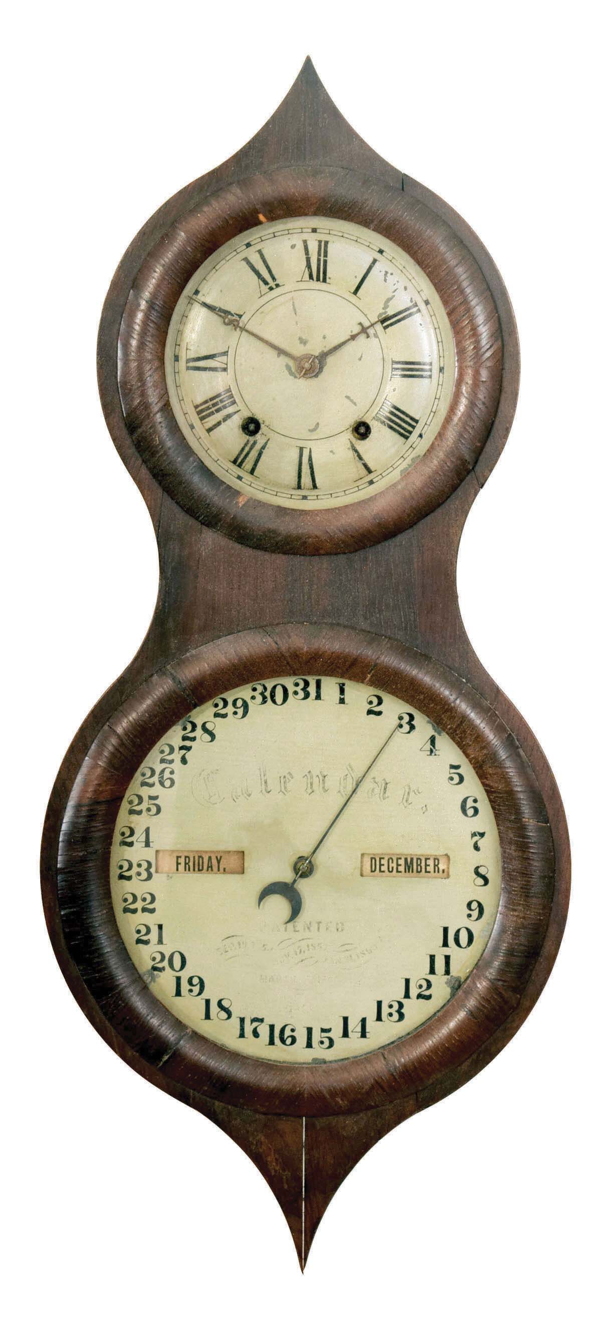Seth Thomas Clock Co., Thomaston, Conn., "Office Calendar No. 3" (commonly called the "Peanut"), hanging double dial calendar clock with a spring driven, 8 day timepiece movement and a Mix Brothers perpetual calendar mechanism in a rosewood veneered case — Antique Clocks Price Guide