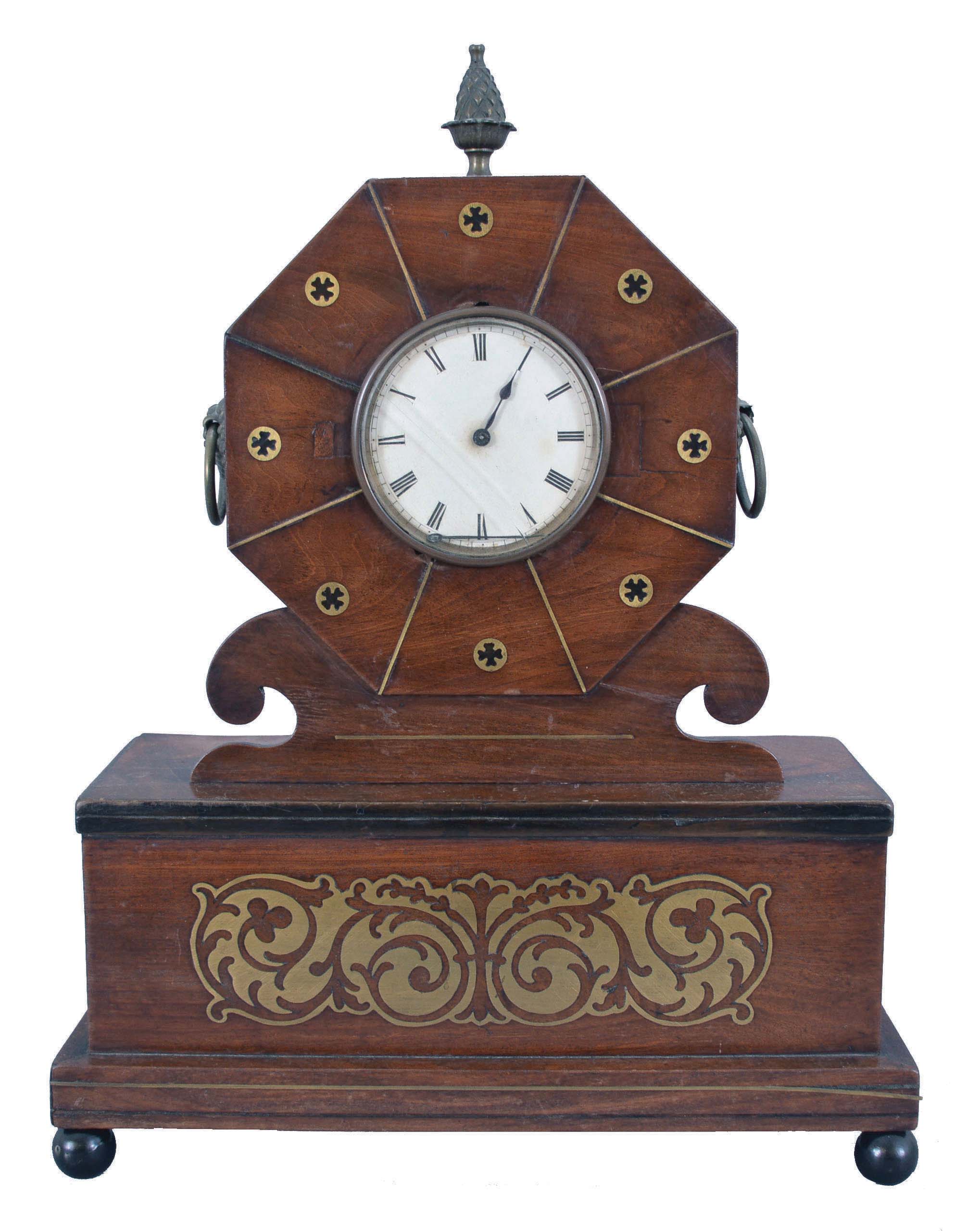 France, mantel clock, 8 day, time only, sping-driven movement with a cylinder escapement in a mahogany case with brass inlay on ball feet supporting a box with drawer that opens to the side, topped with an octagonal head holding a white paper dial with Roman numerals and metal finial. — Antique Clocks Price Guide