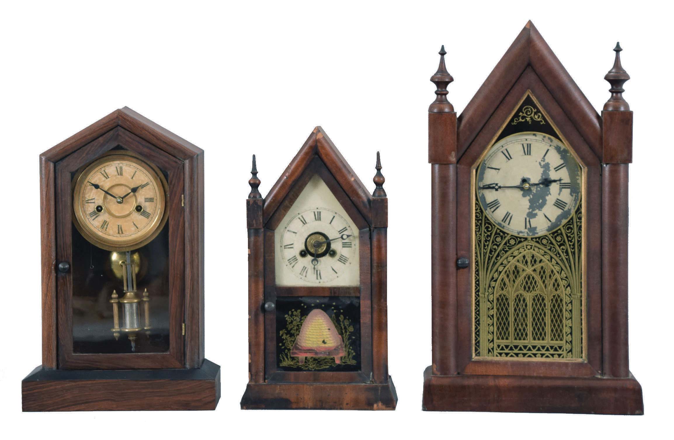 Clocks- 5 (Five): (1) New Haven Clock Co., New Haven, Conn., "Sharp Gothic" shelf clock with a spring driven, 8 day, time and strike movement in a mahogany veneered case, c1880; (2) Jerome & Co., New Haven, Conn., miniature steeple shelf clock with a spring driven 30 hour time and alarm movement in a mahogany veneered case, c1870. (3) F. Kroeber Clock Co., New York, "Dictator" shelf clock with a spring driven 30 hour time and strike movement in a rosewood veneered case, c1885. (4) Brewster & Ingrahams, Bristol, Conn., Round Gothic shelf clock with a spring driven, 8 day, time and strike movement in a mahogany veneered case, c1850, (5) Waterbury Clock Co., Waterbury, Conn., Round Gothic shelf clock with a spring driven 30 hour time, strike and alarm movement in a mahogany veneered case, c1865. — Antique Clocks Price Guide