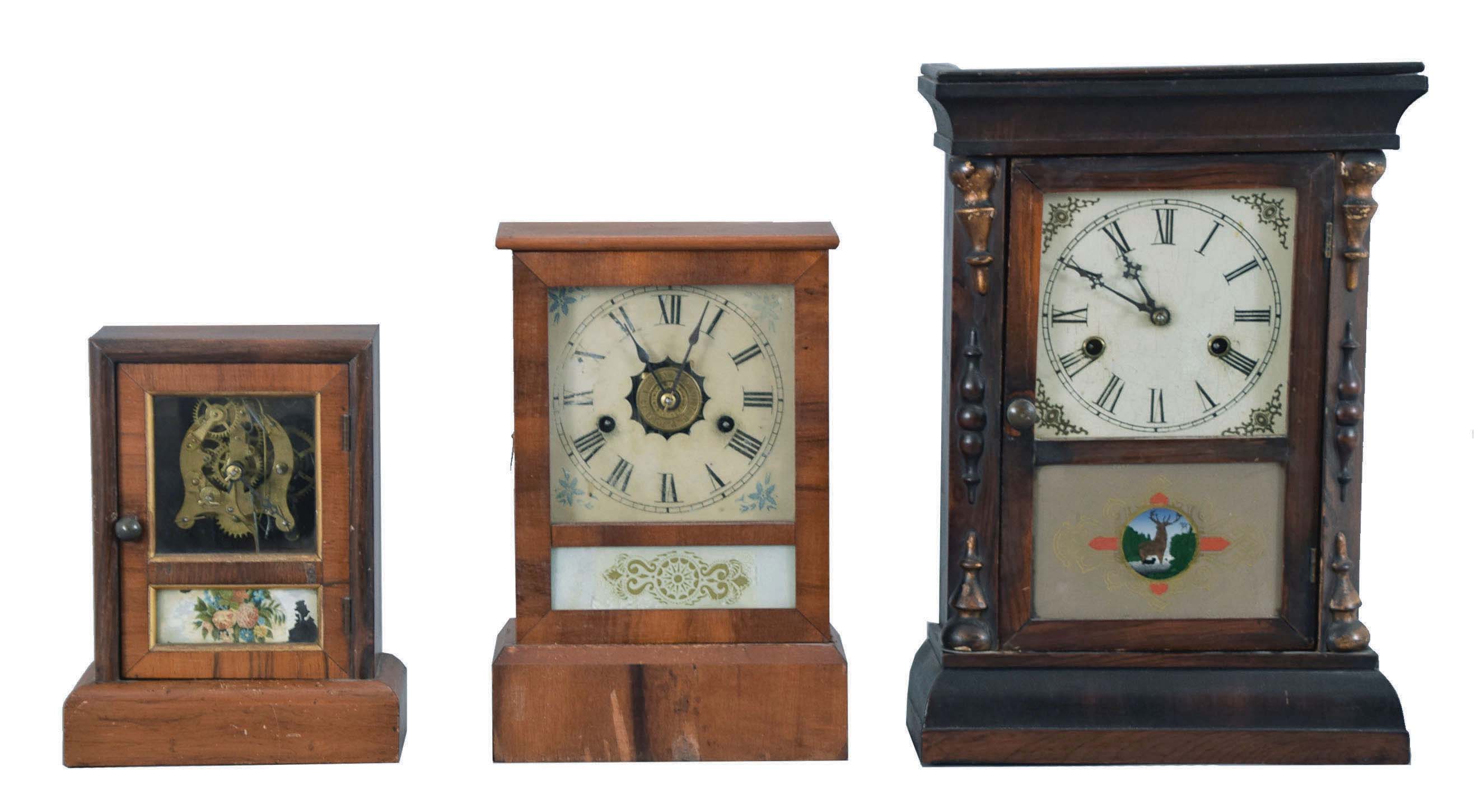 Clocks- 6 (Six): (1) Seth Thomas Clock Co., Thomaston, Conn., "Cottage Extra" shelf clock with a spring driven, 8 day, time and strike movement in a rosewood veneered case; (2) E. N. Welch, Forestville, Conn., cottage shelf clock with a 30 hour timepiece movement in a rosewood veneered case. (3) Waterbury Clock Co., Waterbury, Conn., cottage shelf clock with a spring driven 30 hour time and strike movement in a rosewood veneered case. (4) Seth Thomas Clock Co., Thomaston, Conn., cottage shelf clock with a spring driven 30 hour time and alarm movement in a rosewood veneered case. (5) Jerome & Co., New Haven, Conn., "Cottage No. 2" shelf clock with a spring driven 30 hour time, strike and alarm movement in a veneered case. (6): Gilbert Clock Co., Winsted, Conn., cottage shelf clock with a spring driven 30 hour time and strike movement in a rosewood veneered case. — Antique Clocks Price Guide