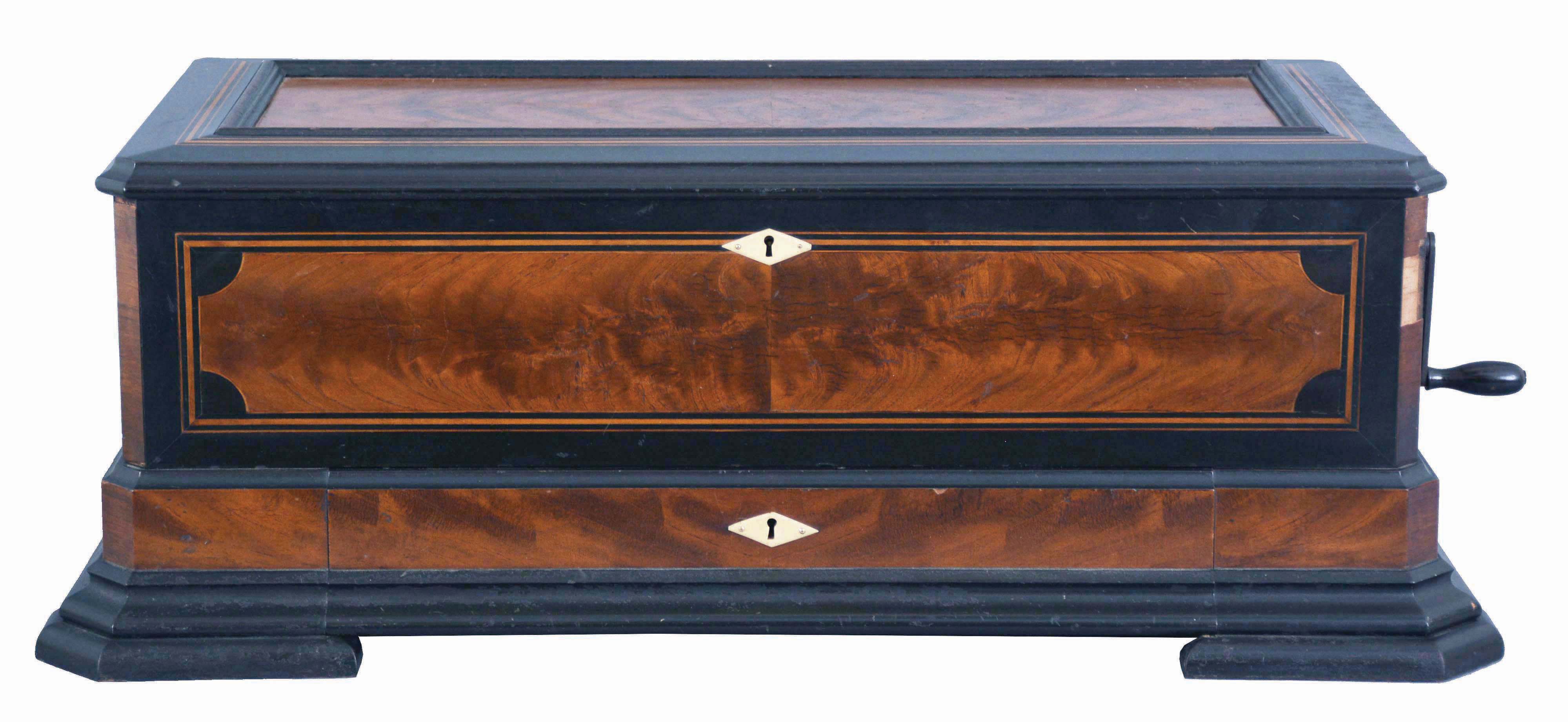 Mermod Freres, St. Croix, Switzerland, cylinder music box, with 4 eleven inch cylinders [3 fit in drawer built into case], each cylinder with 6 tunes. This is an ideal "Piccolo" format box, with tune number indicator, and Jacot "Safety Check", external crank wound, in an inlaid case with 45 degree corners. No tune sheets. WITH a non-matching but sturdy stained pine table from the same period with heavy turned legs. — Antique Clocks Price Guide