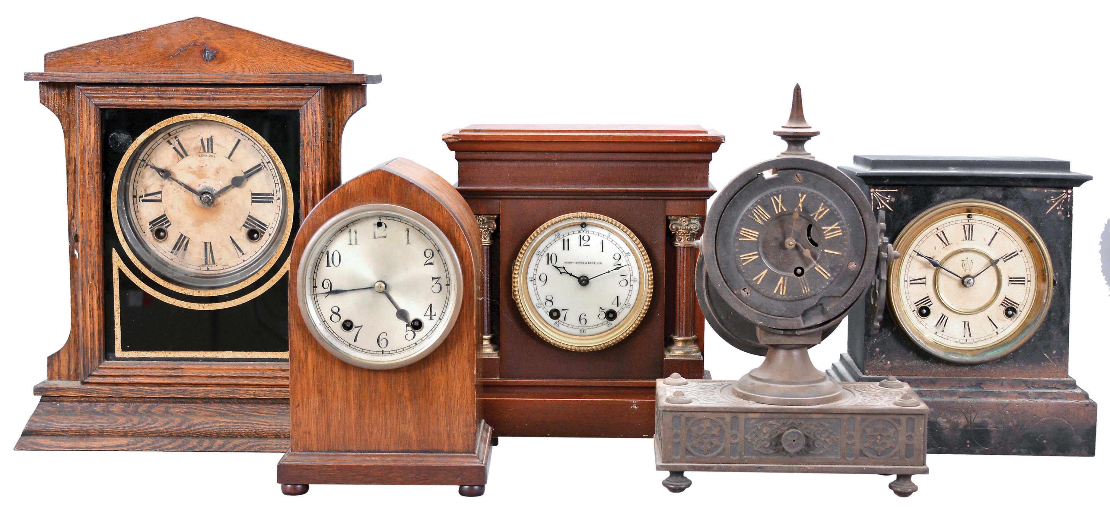 Clocks- 5 (Five) Mantel: small time and strike gothic in a mahogany case, a Sessions time and strike in an oak case, a Waterbury time and strike in a black enameled iron case, a Seth Thomas time and strike in a mahogany case sold by Henry Birks & Sons, and a time only "Tucker Bronze" in a cast iron case. — Antique Clocks Price Guide